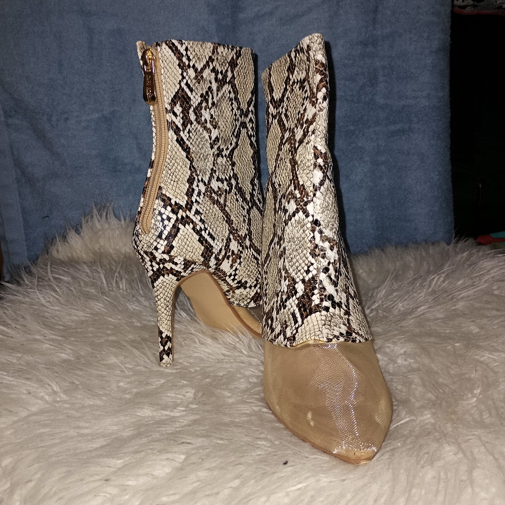 Hi ankle point the toes stiletto heel snake print and mesh panel at toe.